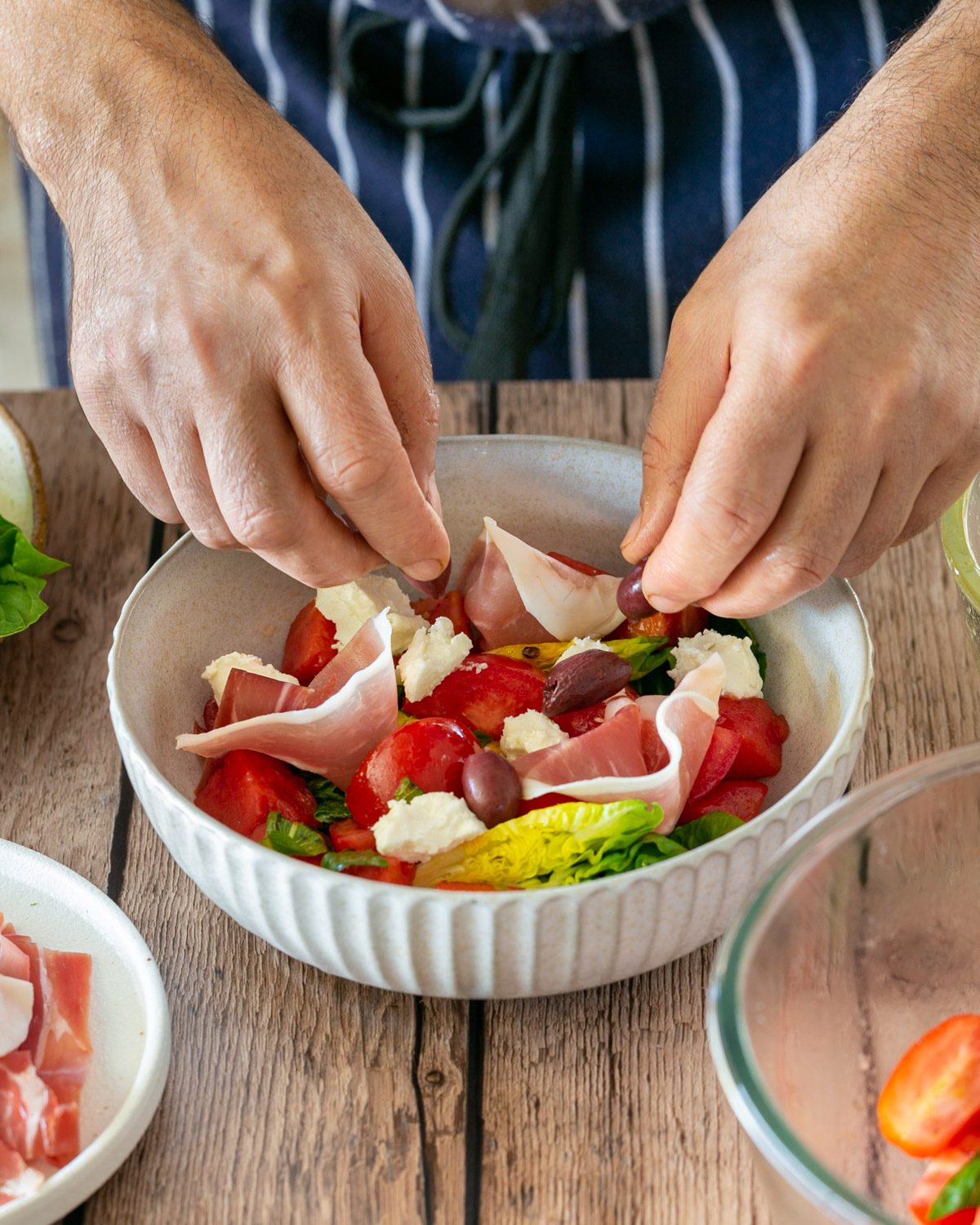 Adding olives to the salad