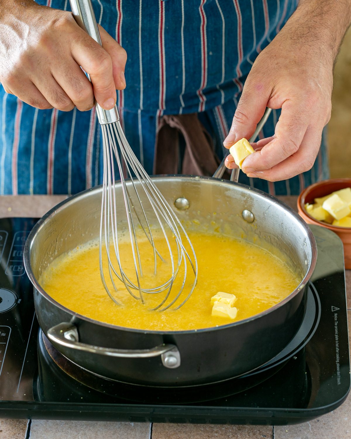 Adding butter to yuzu curd