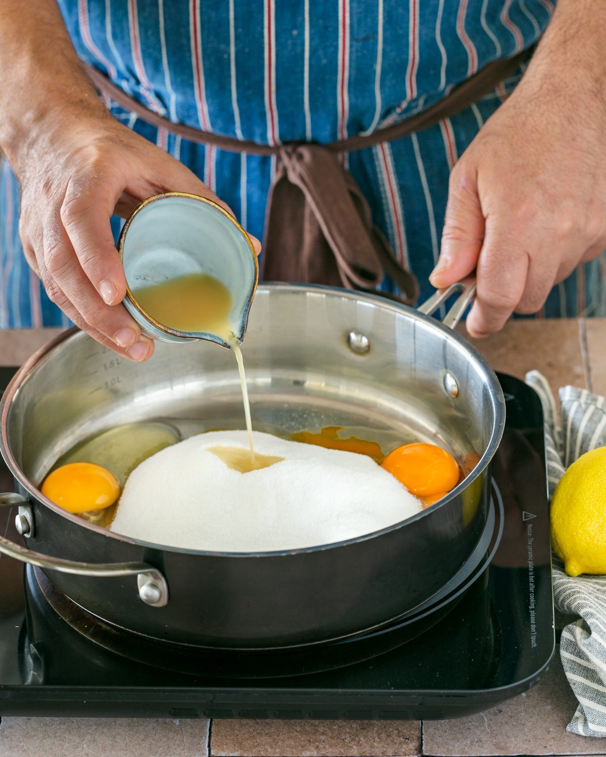 Adding yuzu juice to egg sugar mix