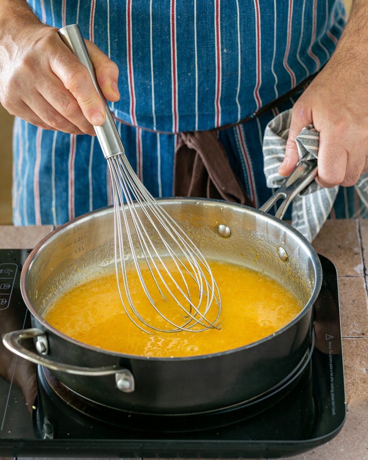 cooking the yuzu curd on low heat