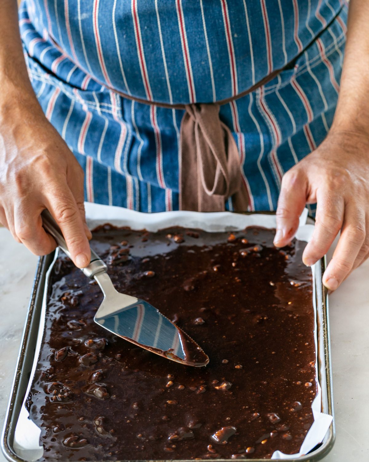 Brownie batter poured into baking tray