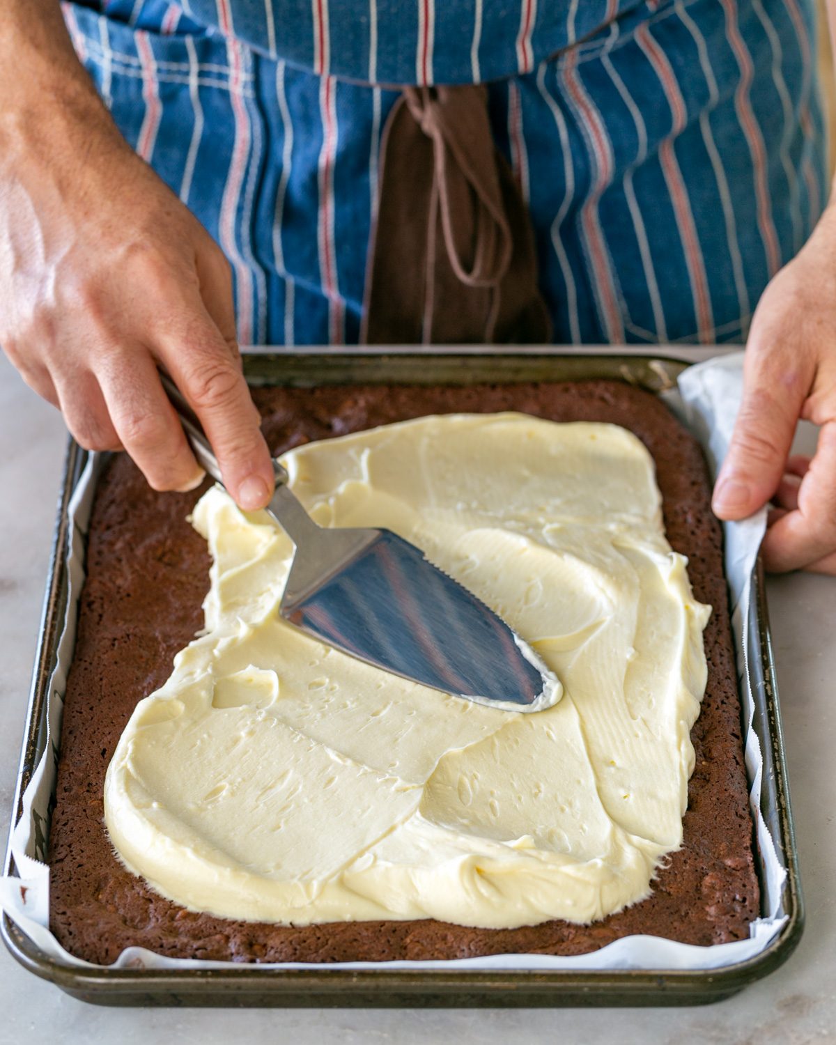 Cream cheese layer spread over brownie layer
