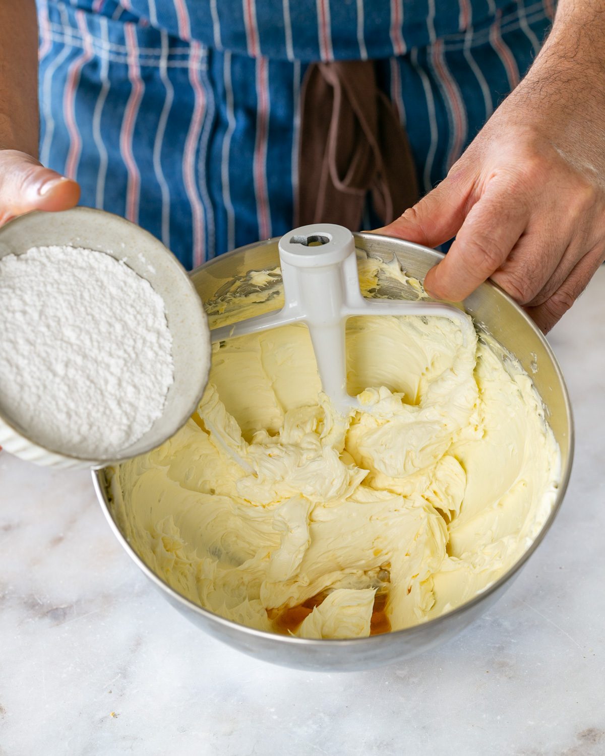 Icing sugar added to cream cheese mix