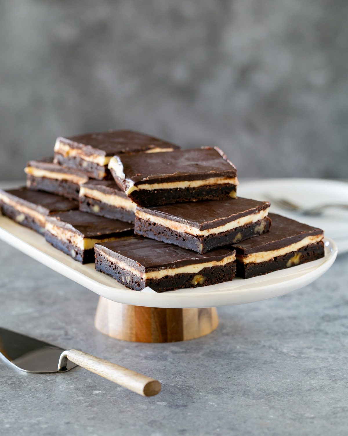 Coffee Walnut Brownie Slices arranged on a stand