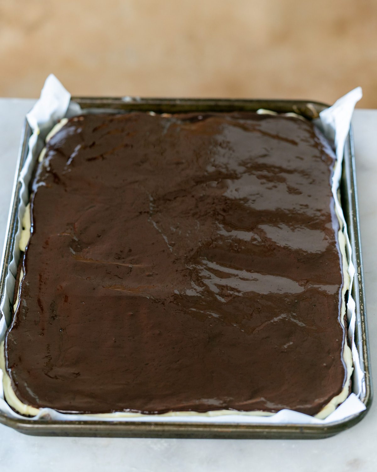 Coffee walnut brownie slice ready to be chilled