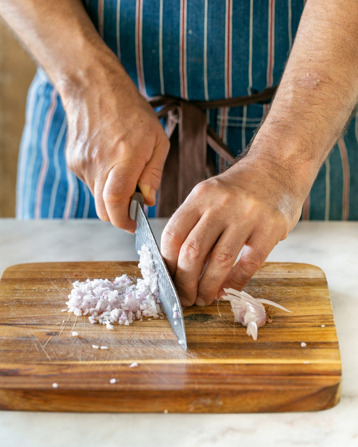 Chopping shallots to make a mignonette