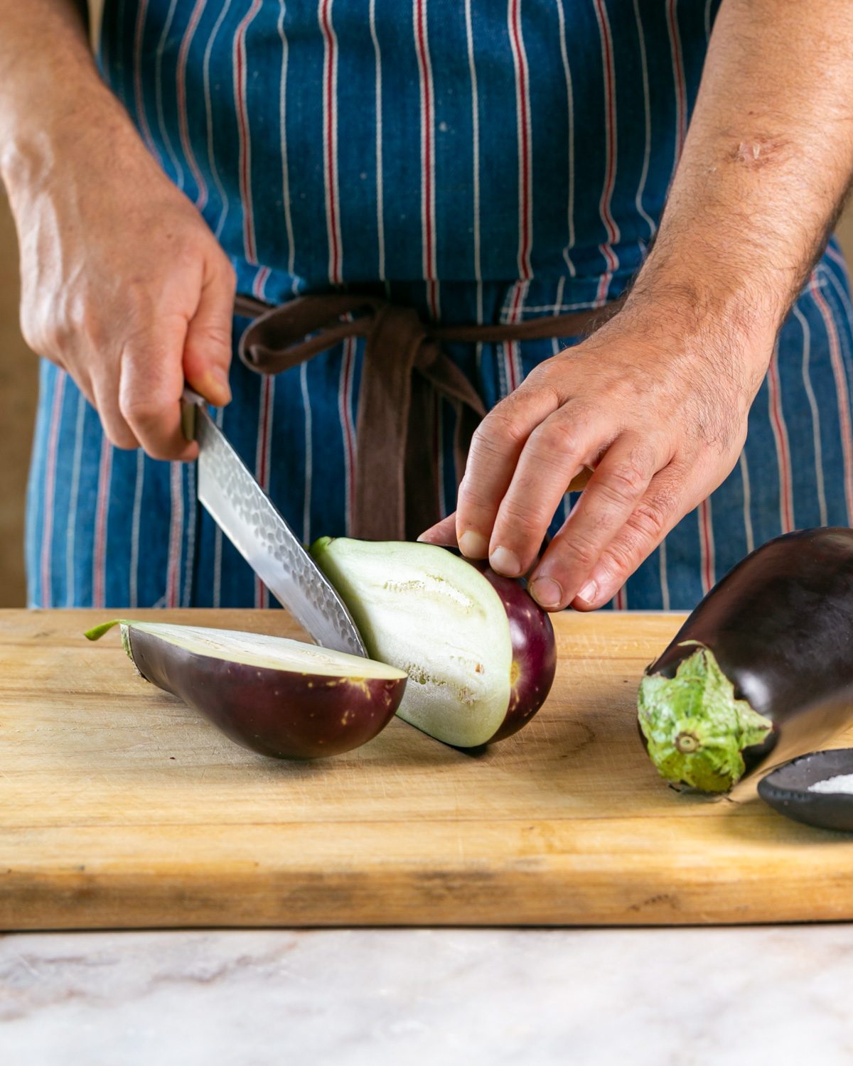 Cutting the eggplant in half