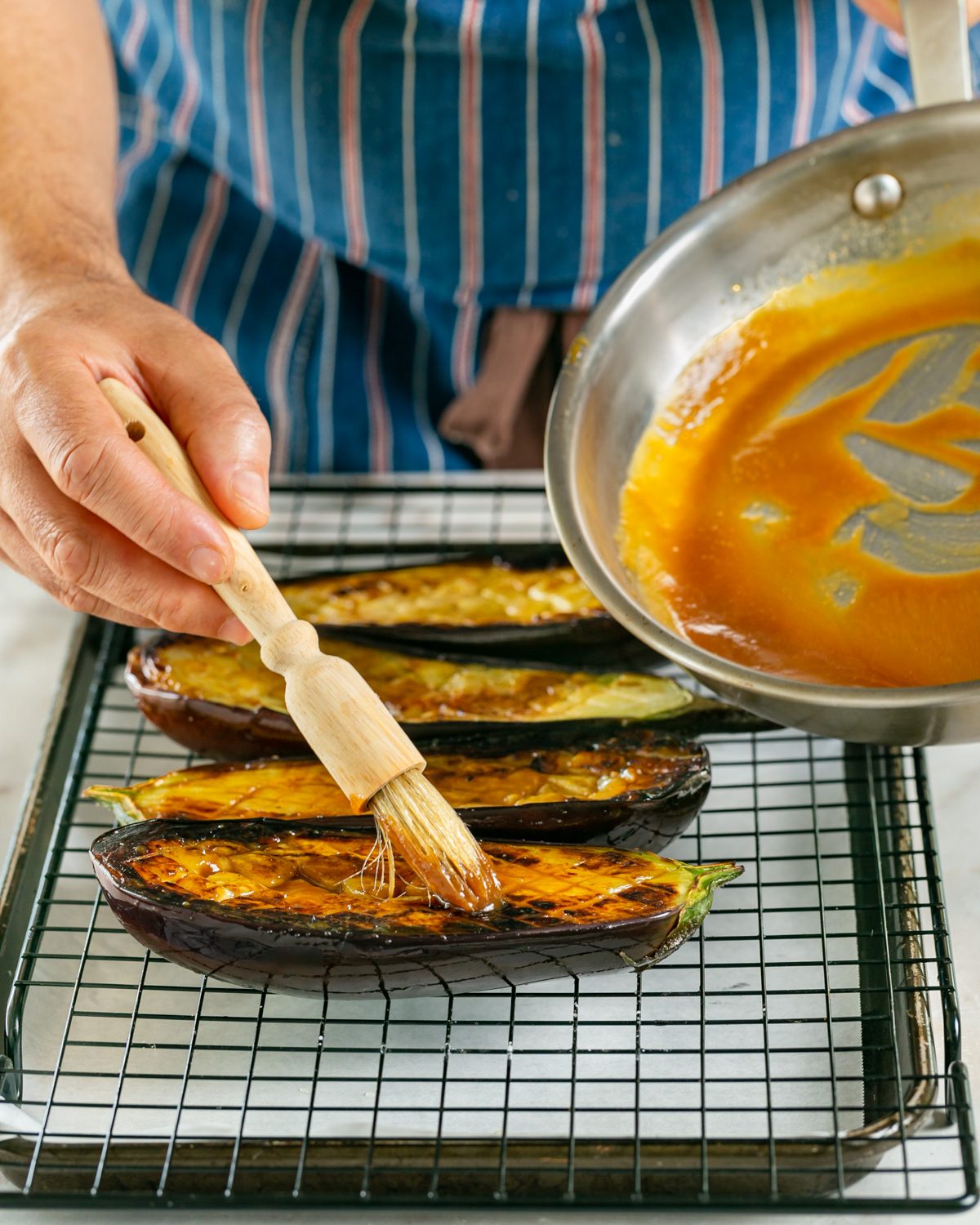 Applying miso glaze on eggplant