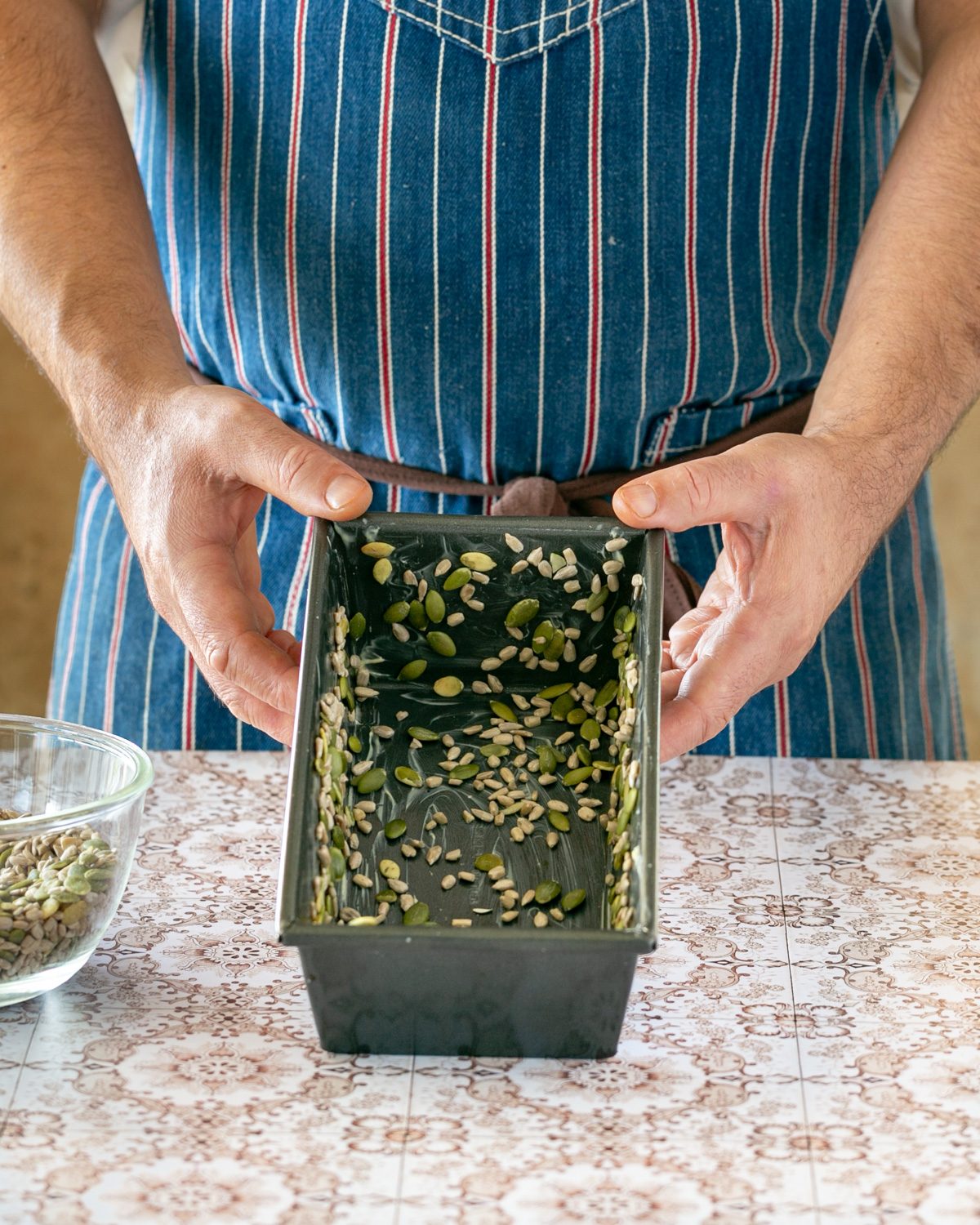 Preparing the tin to bake bread